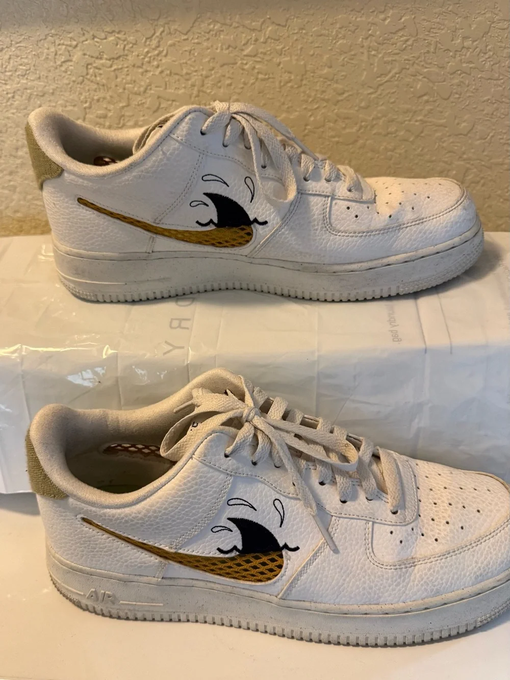 Men's White Nike Athletic Sneakers with Gold Accent